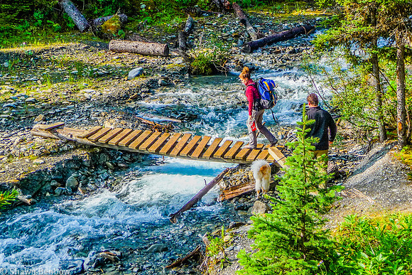 Christina, Charlie, and Adam crossing Numa Creek at the campground.