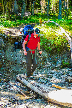 Mark crossing the tributary of Tumbling Creek.