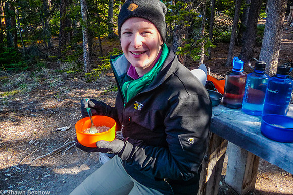 Jenn eating breakfast at the Glacier Lake Campground.