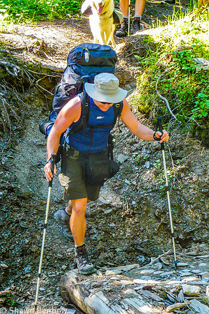 Shawn crossing a small tributary to Tumbling Creek.