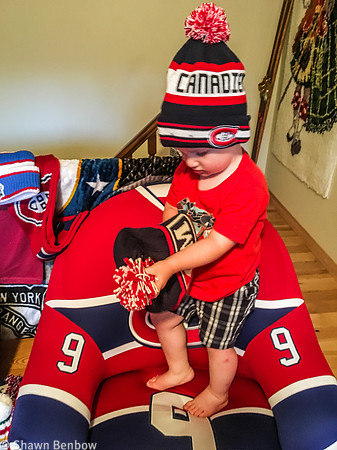 James with Uncle Bruce's Canadiens toques on the Richard Chair.