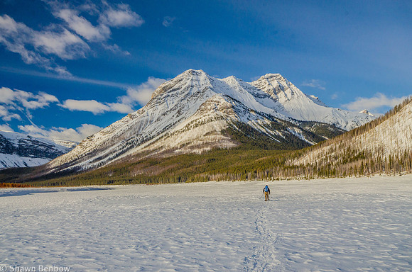 Bruce snowshoeing across the Spray Lakes Reservoir.