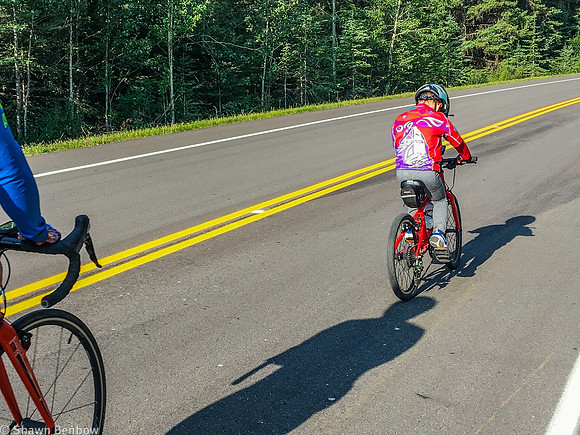 James biking past Jenn.