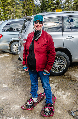 Jenn with her snowshoes on, waiting at the Emerald Lake parking lot.