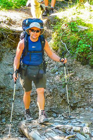 Shawn crossing a small tributary to Tumbling Creek.