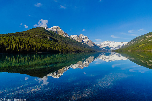 Mount Outram, Mount Forbes, and Division Mountain reflected in Glacier Lake.