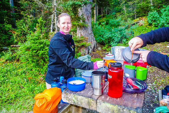 Jenn making coffee, tea, and oatmeal at breakfast.