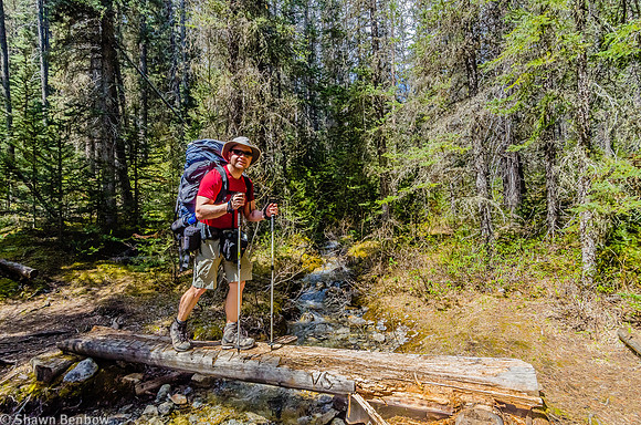 Shawn crossing one of several small bridges on a tributary to the Hoese River.