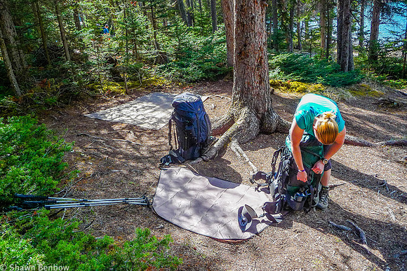 Jenn packing up her backpack at the Glacier Lake Campground.