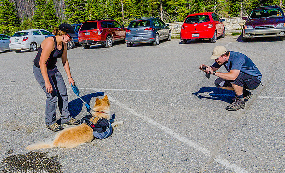 Adam taking a photo of Christina and Charlie