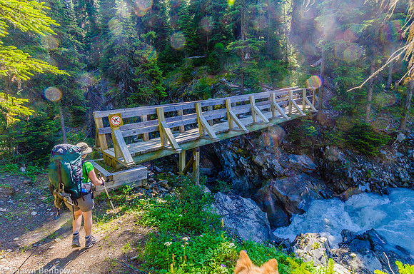 Jenn standing on the north bank of Tumbling Creek. Even this bridge looked like it was smashed during the spring flooding becasue there were some bent boards and the bridge wasn't level.