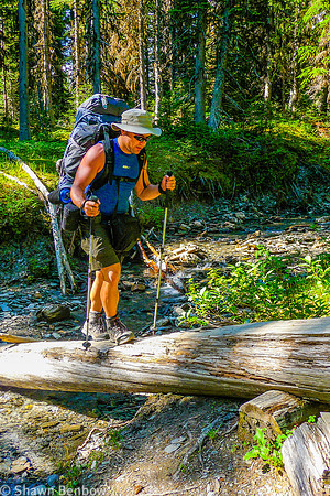 Shawn crossing a small tributary to Tumbling Creek.
