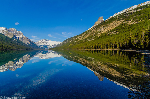Mount Forbes, Divisoin Mountain, and Sullivan Peak reflected in Glacier Lake.