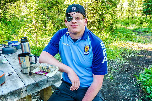 Mark eating his granola and coffee at Helmet Falls Campground.